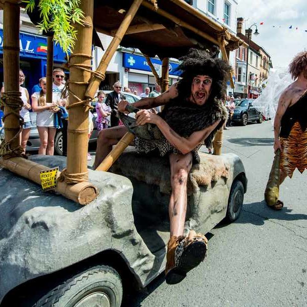 Pre Hee Men and their caveman car